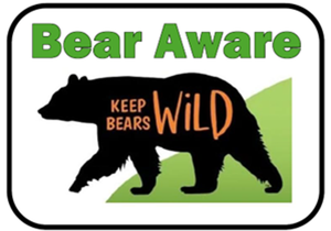 A sign with a bear silhouette and the words KEEP BEARS WILD inside. Above the bear, Bear Aware is written in green bold letters, all set against a green and white background.